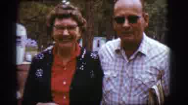 Flagstaff Arizona (1968): Happy Couple Walking Towards Their Turquoise Vintage Car