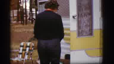 Flagstaff Arizona (1968): Old Footage Of Woman Putting Something In A Travel