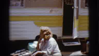 Flagstaff Arizona (1968): Three People Sit Outside Their Camper And Chat On A