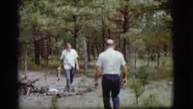 Flagstaff Arizona (1968): Two Older Men In White Shirts And Jeans Collecting