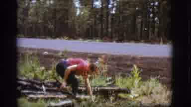 Flagstaff Arizona (1968): Woman Gathers Firewood As A Man With An Arm Full Of Fire