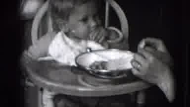 New Hampshire USA (1942): Baby Eating Using Hands Sitting In An High Chair And Mom