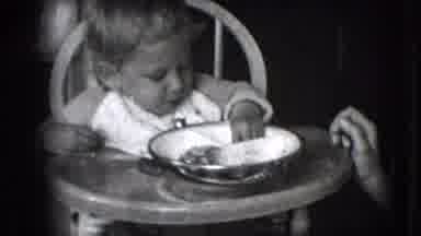 New Hampshire USA (1942): Baby Child Eating Food Plate Hands High Chair Dog Adult