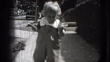 New Hampshire USA (1942): Baby Walking Towards Camera While Eating Food