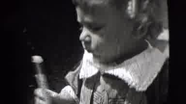 New Hampshire USA (1942): Playful Baby Eating Candy