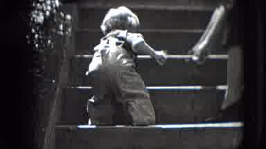New Hampshire USA (1942): Child Sits On The Ground Then Learns To Climb The Steps
