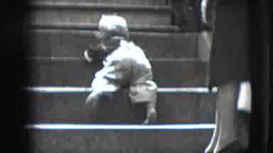 New Hampshire USA (1942): Mother Watches Toddler Attempting To Climb Stairs For