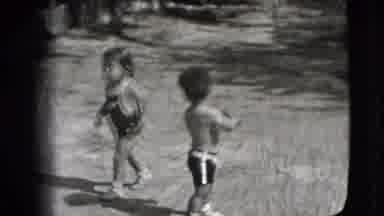 New Hampshire USA (1942): Little Girl In Bathing Suit Walking Around On The Sand