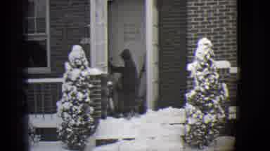 Buffalo New York (1944): An Older And A Younger Child Walk Outside Of A House On A