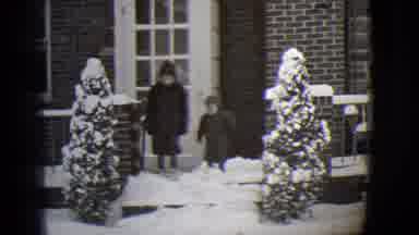 Buffalo New York (1944): A Baby And Kid Are Walking On Snow In Front Of Door Of