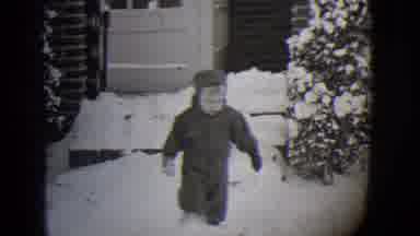Buffalo New York (1944): Kid Stomping Through Snow Outside Of His House