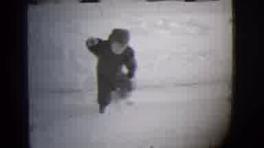 Buffalo New York (1944): Small Child Bundled Up In Winter Clothes Trudges Through