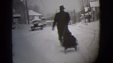 Buffalo New York (1944): Man In Winter Coat And Hat Pulling A Little Kid On A Sled