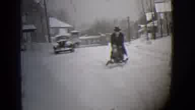 Buffalo New York (1944): Blank And White Clip Of Man Pushing Two Children On Sled