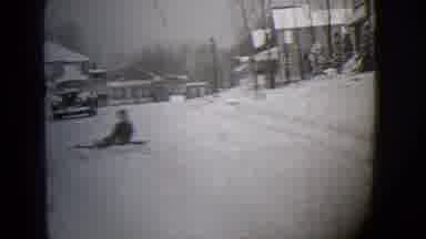 Buffalo New York (1944): Little Kid Sledding On A Street Filled With Snow