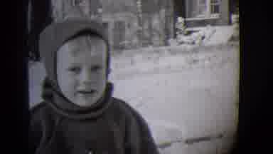 Buffalo New York (1944): Young Boy Bundled Up In Warm Clothing Playing Outside In