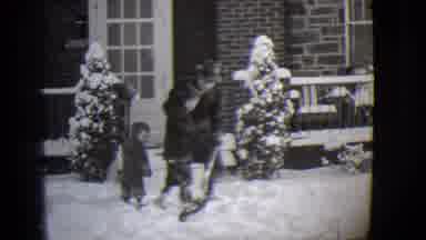Buffalo New York (1944): Father Takes Shovel To Help His Children Shovel The Snow