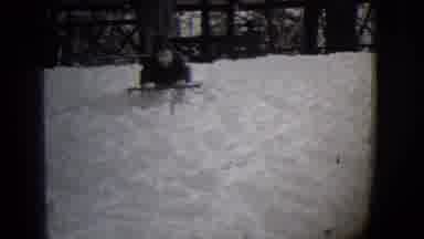 Buffalo New York (1944): Kid Sledding Down Small Snow Hill Then Reaches The Bottom