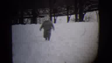 Buffalo New York (1944): Toddler Wearing Snowsuit Walks Through Snow On A Clear