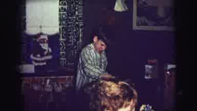 Lynbrook New York USA (1976): Kid Trying To Open A Crossword Box