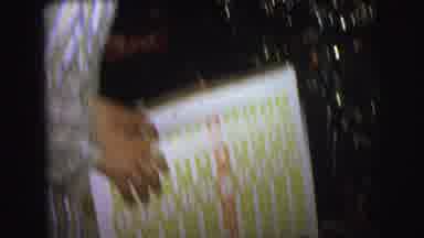 Lynbrook New York USA (1976): Two Boys In Pajamas Examine Wrapped Presents