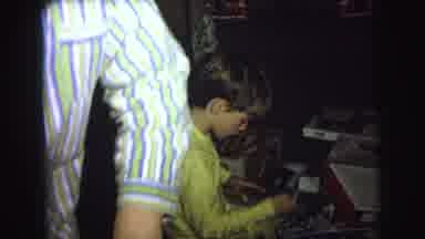 Lynbrook New York USA (1976): A Boy In Yellow Pajamas Sitting Under A Tree Opening