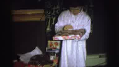 Lynbrook New York USA (1976): Two Young Children Wearing Pajamas Unwrapping