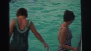 Yellowstone Wyoming USA (1971): Woman Holds On To A Swimming Pool Ladder As A