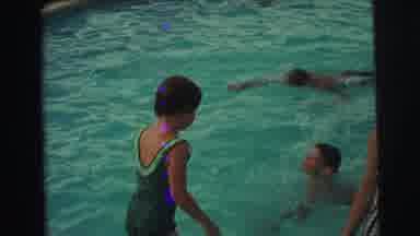 Yellowstone Wyoming USA (1971): Mother In Pool Wearing Vintage Swimsuit Playing