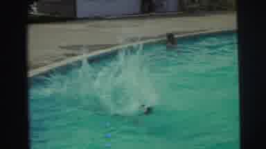 Yellowstone Wyoming USA (1971): Kid Belly Flopping Into Pool And Then Swimming By