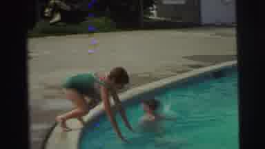 Yellowstone Wyoming USA (1971): A Girl In A Green Swimsuit Dives Off The Side Of A
