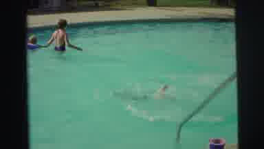 Yellowstone Wyoming USA (1971): Young Girl Swims A Short Distance Under Water In A