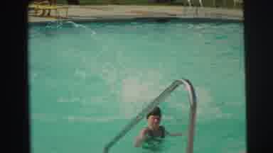 Yellowstone Wyoming USA (1971): Boy Wearing Green Shorts Jumps Into Pool On A