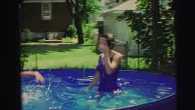 Yellowstone Wyoming USA (1971): Mom Son And Daughter Splashing And Swimming In A