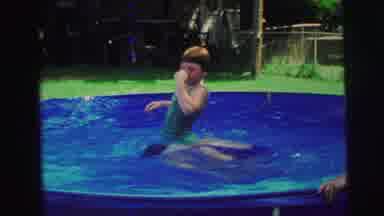 Yellowstone Wyoming USA (1971): Girl Wearing Green Swimwear Is Flipped In Pool By