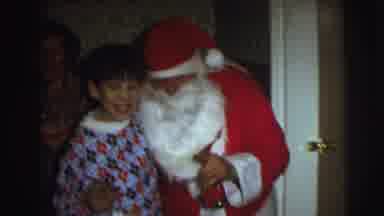 East Lansing Michigan (1972): Woman Wearing Blue Sweater Hang Red Christmas