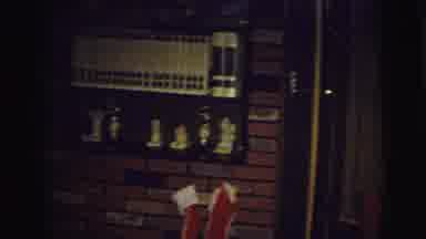 East Lansing Michigan (1972): Boy Wearing Argyle Pajamas Hangs Red Christmas