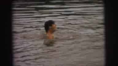 Superior Wisconsin (1973): Guy Swimming In Lake Towards His Friend Who Is Exiting