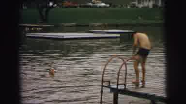 Superior Wisconsin (1973): Children Play And Swim From A Wooden Dock On A Small