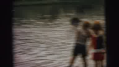 Superior Wisconsin (1973): People Diving And Swimming In A River During The Day
