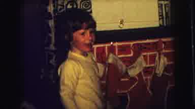 Superior Wisconsin (1973): Boy Stands At Mantle Where Stockings Are Hung And Then