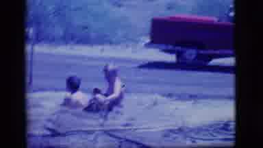 Ely Nevada-1968: Two Little Boys Playing In A Self Made Mud Pit Filled With