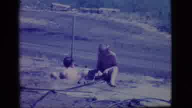 Ely Nevada-1968: Two Little Boys Playing In A Self Made Mud Pit Filled With