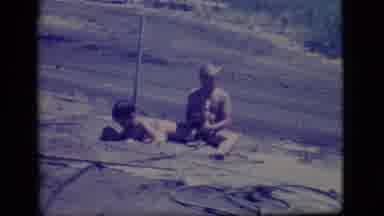 Ely Nevada-1968: Two Small Boys Playing In Mud Pit Throwing Mud On Each Other