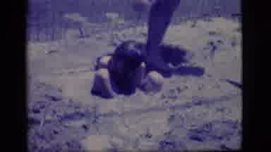 Ely Nevada (1968): One Boy Laying Down A Hose As He Sits Down Next To Another