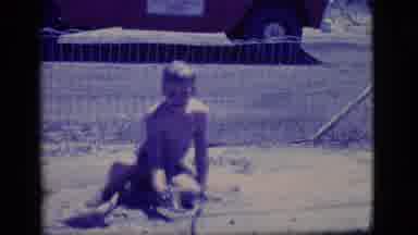 Ely Nevada (1968): Two Boys Playing In The Mud Outside With A Garden Hose And A