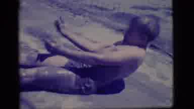 Ely Nevada (1968): Two Small Boys Laying And Sitting In Mud Pit Rubbing Mud On