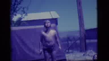 Ely Nevada (1968): A Scene Of Two Kids Playing Outside In The Mud