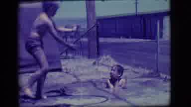 Ely Nevada (1968): Two Boys Are Happy To Play In A Puddle Of Their Own Creation
