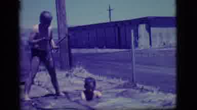 Ely Nevada (1968): Two Boys Play Happily In Mud In A Hole Next To A Street